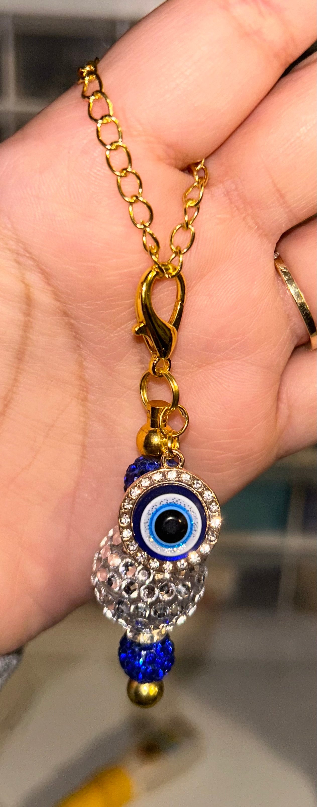 Evil eye gold cup charm