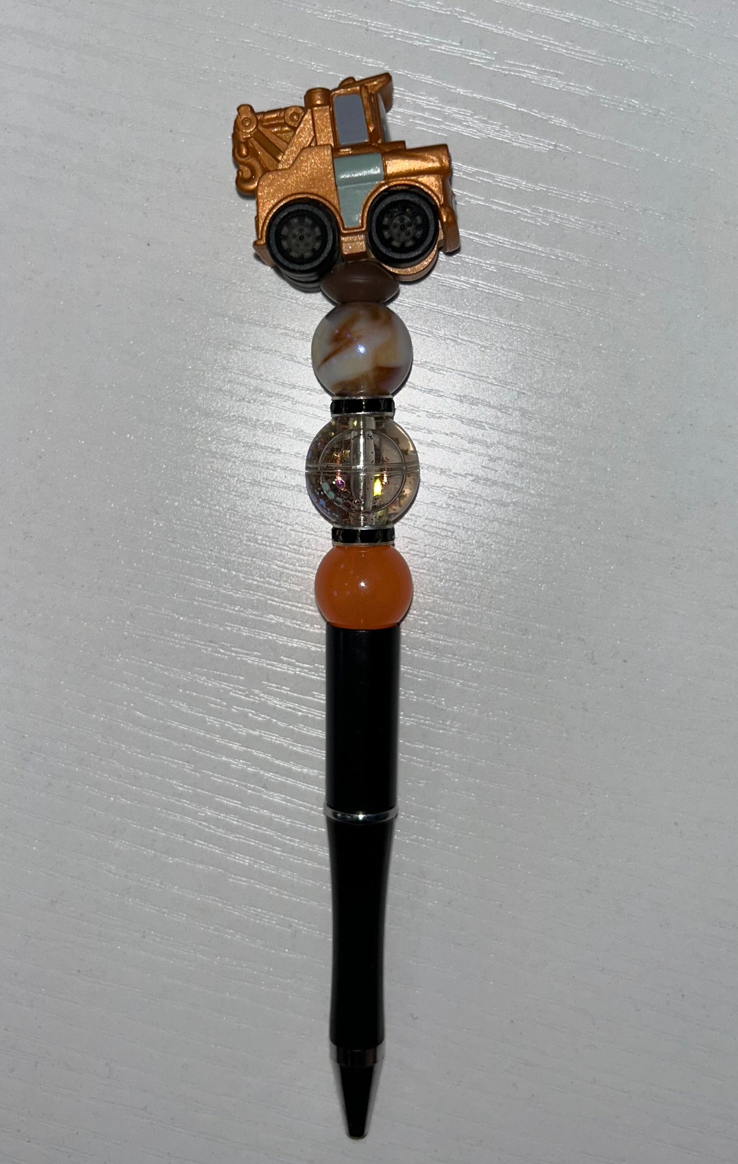 Brown tow truck pen