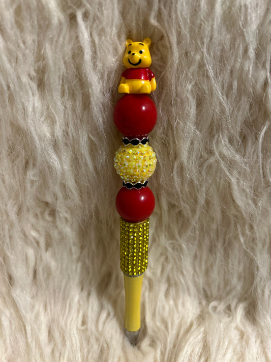 Red and yellow Winnie the Pooh pen